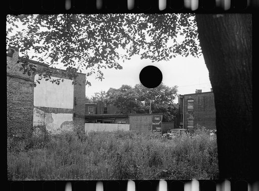 Untitled photo, possibly related to: Front of Negro home near Capitol, Washington, D.C. Interiors of these homes vary little. A chair or two and a table, a bed and perhaps an extra mattress on the floor cares for six to ten people