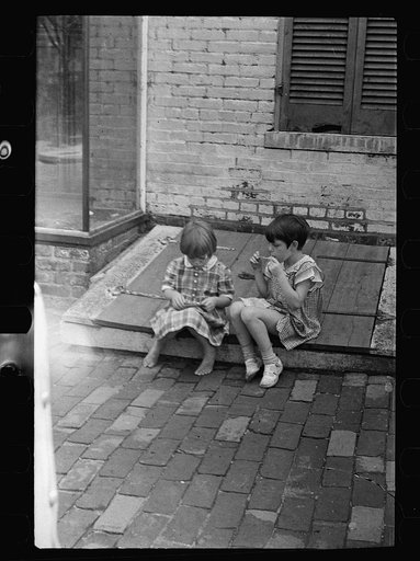 Small girls sitting on cellar door, Georgetown, Washington, D.C.