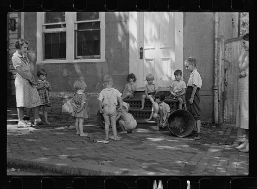 Untitled photo, possibly related to: Poor children playing on sidewalk, Georgetown, Washington, D.C.