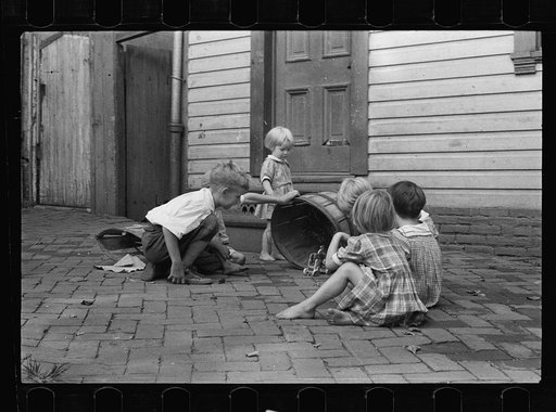Untitled photo, possibly related to: Poor children playing on sidewalk, Georgetown, Washington, D.C.
