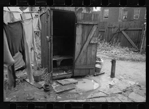 Backyard and privy near Government Printing Office, Washington, D.C. The pump on the right supplies water for the house back of privy