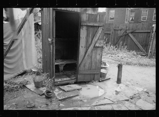 Untitled photo, possibly related to: Backyard and privy near Government Printing Office, Washington, D.C. The pump on the right supplies water for the house back of privy