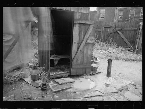 Untitled photo, possibly related to: Backyard and privy near Government Printing Office, Washington, D.C. The pump on the right supplies water for the house back of privy