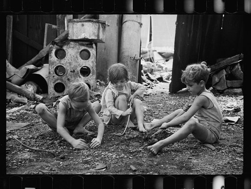 Untitled photo, possibly related to: Slum children at play, Washington, D.C. Children in their backyard near the Capitol. This area inhabited by both black and white