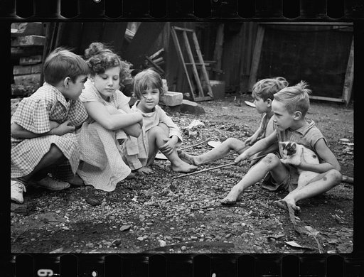 Untitled photo, possibly related to: Slum children at play, Washington, D.C. Children in their backyard near the Capitol. This area inhabited by both black and white