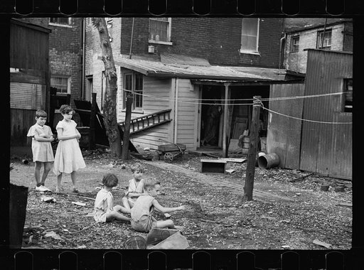Untitled photo, possibly related to: Slum children at play, Washington, D.C. Children in their backyard near the Capitol. This area inhabited by both black and white