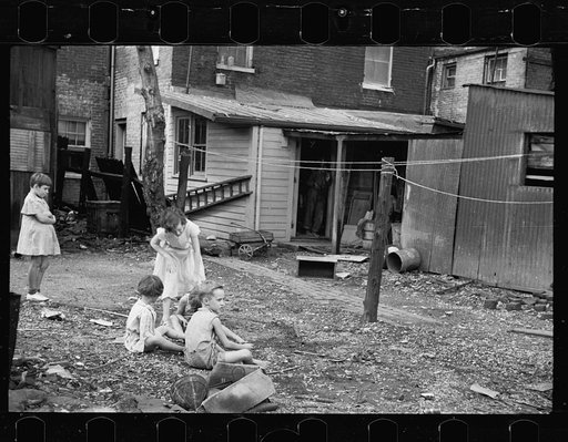 Untitled photo, possibly related to: Slum children at play, Washington, D.C. Children in their backyard near the Capitol. This area inhabited by both black and white