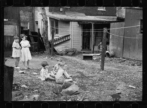 Untitled photo, possibly related to: Slum children at play, Washington, D.C. Children in their backyard near the Capitol. This area inhabited by both black and white