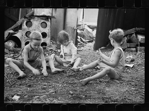 Untitled photo, possibly related to: Slum children at play, Washington, D.C. Children in their backyard near the Capitol. This area inhabited by both black and white