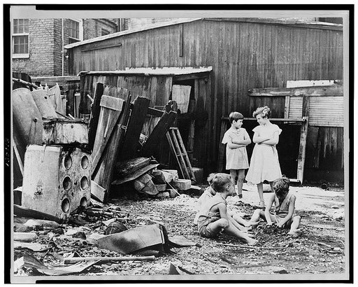 Slum children at play, Washington, D.C. Children in their backyard near the Capitol. This area inhabited by both black and white