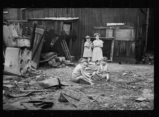 Untitled photo, possibly related to: Slum children at play, Washington, D.C. Children in their backyard near the Capitol. This area inhabited by both black and white