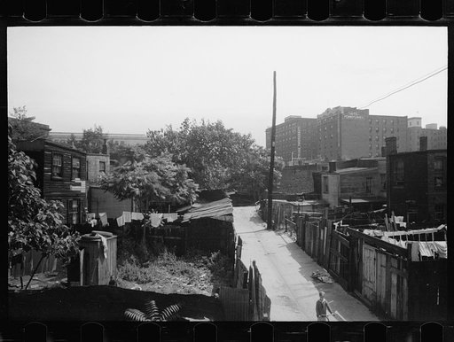 Untitled photo, possibly related to: Children in slum area, Washington, D.C. Children in their backyard in a slum area near the Capitol. This area inhabited by both black and white