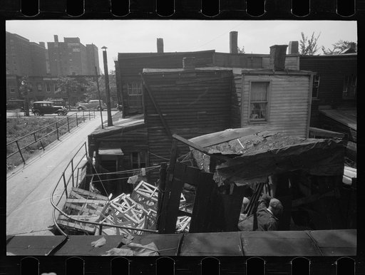 Untitled photo, possibly related to: Negro backyard, Washington, D.C. Backyard near Stratford Hotel and within short distance from both the Capitol and Union Station, showing flooded yard and debris. In big rains, kitchen and bedroom floors of this house are so flooded that it is necessary to lay pl