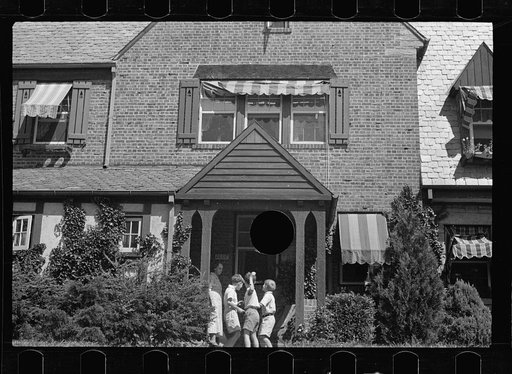 Untitled photo, possibly related to: Washington's healthy children. At play on the front lawn of one of Washington's better housing sections. These houses have both sweeping front lawns and clean backyards