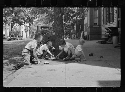 Untitled photo, possibly related to: Washington's healthy children. At play on the front lawn of one of Washington's better housing sections. These houses have both sweeping front lawns and clean backyards