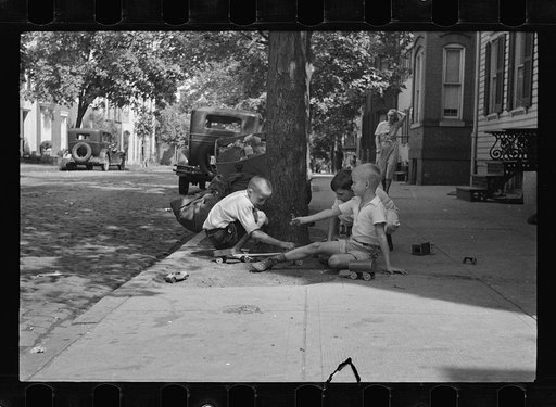 Untitled photo, possibly related to: Washington's healthy children. At play on the front lawn of one of Washington's better housing sections. These houses have both sweeping front lawns and clean backyards
