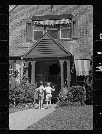 Untitled photo, possibly related to: Washington's healthy children. At play on the front lawn of one of Washington's better housing sections. These houses have both sweeping front lawns and clean backyards
