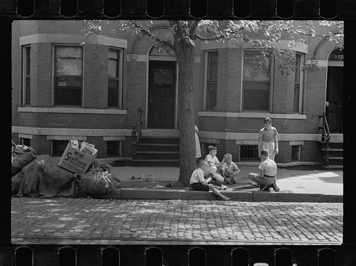 White children playing, Georgetown, Washington, D.C., using the only available playground, the city sidewalk. This section is mixed black and white