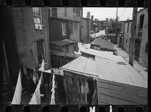 Untitled photo, possibly related to: Typical slum area. Note dome of Capitol, Washington, D.C.