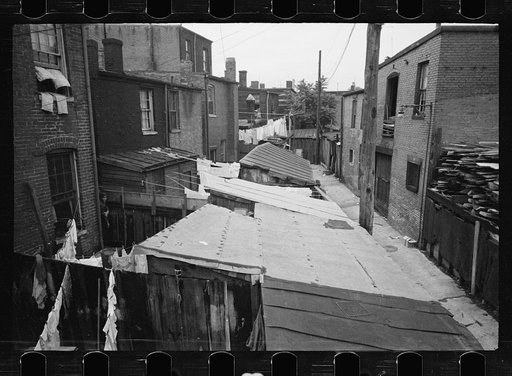 Untitled photo, possibly related to: Typical slum area. Note dome of Capitol, Washington, D.C.