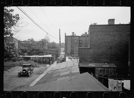 Typical slum area. Note dome of Capitol, Washington, D.C.