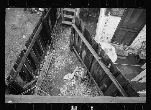 Untitled photo, possibly related to: Typical slum area. Note dome of Capitol, Washington, D.C.