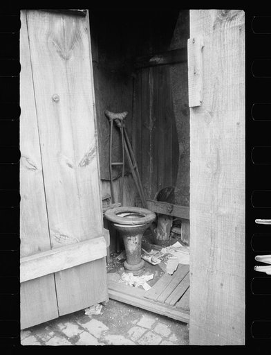 Negro slum, unkept privy, Washington, D.C. Within a few hundred yards of the new House office building is a row of these unkept privies