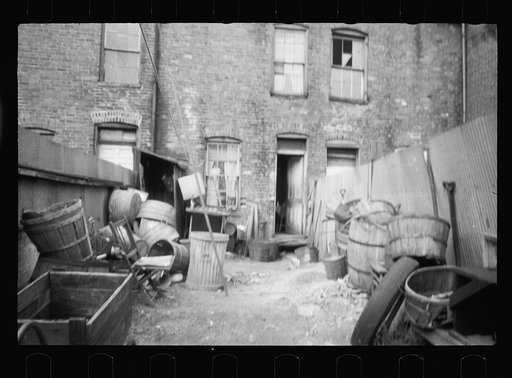 Untitled photo, possibly related to: Slum backyard water supply, Washington, D.C. Backyard typical to a group of houses very close to the House office building, showing only available water supply