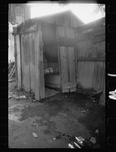 Untitled photo, possibly related to: Slum backyard water supply, Washington, D.C. Backyard typical to a group of houses very close to the House office building, showing only available water supply