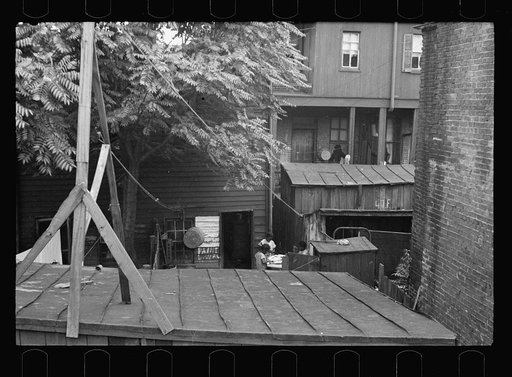 Untitled photo, possibly related to: Typical slum area. Note dome of Capitol, Washington, D.C.