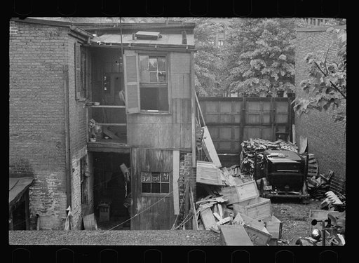 Untitled photo, possibly related to: Typical slum area. Note dome of Capitol, Washington, D.C.