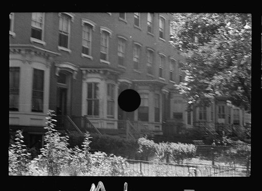 Untitled photo, possibly related to: Typical slum area. Note dome of Capitol, Washington, D.C.