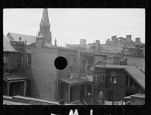 Untitled photo, possibly related to: Typical slum area. Note dome of Capitol, Washington, D.C.