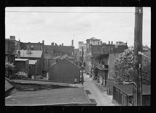 Untitled photo, possibly related to: Typical slum area. Note dome of Capitol, Washington, D.C.