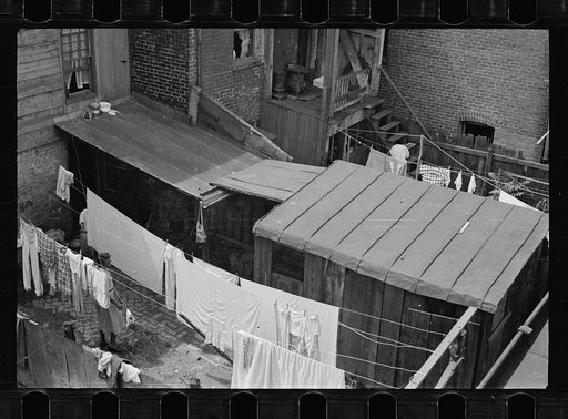 Untitled photo, possibly related to: Typical slum area. Note dome of Capitol, Washington, D.C.