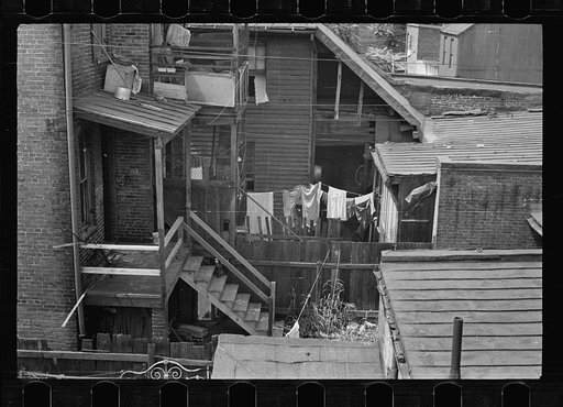 Untitled photo, possibly related to: Typical slum area. Note dome of Capitol, Washington, D.C.