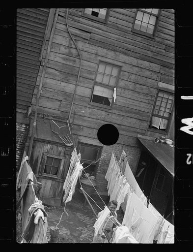 Untitled photo, possibly related to: Typical slum area. Note dome of Capitol, Washington, D.C.