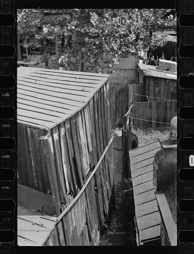 Untitled photo, possibly related to: Typical slum area. Note dome of Capitol, Washington, D.C.