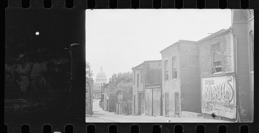 Untitled photo, possibly related to: Slums near the Capitol, Washington, D.C. With the Capitol clearly in view, these houses exist under the most unsanitary conditions; outside privies, no inside water supply and overcrowded conditions