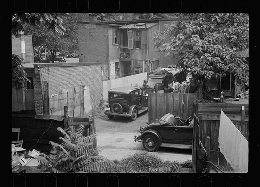 Untitled photo, possibly related to: Typical slum area. Note dome of Capitol, Washington, D.C.