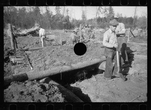 Untitled photo, possibly related to: Transient worker clearing land, Prince George's County, Maryland