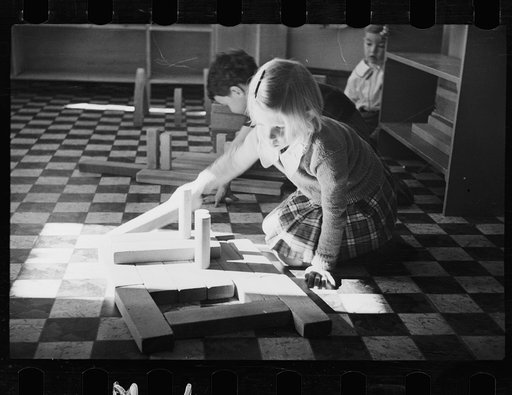 Untitled photo, possibly related to: Radburn, New Jersey, a privately financed model town which furnished some of the ideas for the United States Suburban Resettlement Administration's Greenbelt towns. Young artist at the community kindergarten