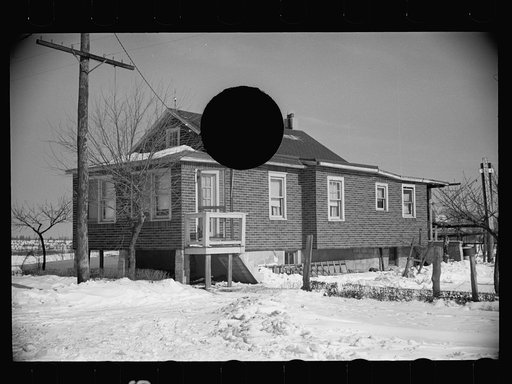 Untitled photo, possibly related to: Cheap false brick tarpaper-covered wooden house typical of subdivision sections in Franklin Township, Amwell Road, West New Brunswick near Derussey land, New Jersey