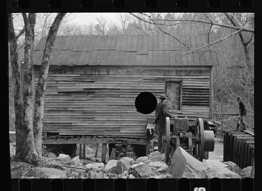 Untitled photo, possibly related to: Demonstrating unique homemade cider press invented by man living on Crabtree Recreational Demonstration Area, Raleigh, North Carolina