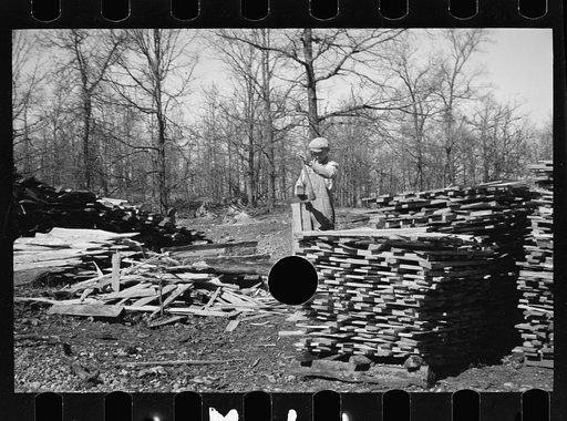 Untitled photo, possibly related to: Splitting shingles with froe and maul on Coalins Project area farm, in western Kentucky