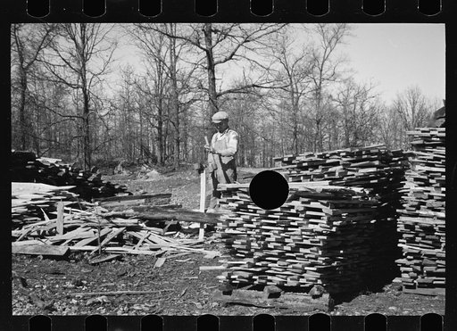 Untitled photo, possibly related to: Splitting shingles with froe and maul on Coalins Project area farm, in western Kentucky