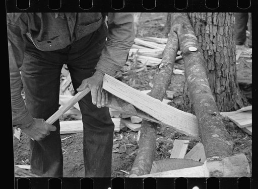 Splitting shingles with froe and maul on Wilson Cedar Forest, near Lebanon, Tennessee