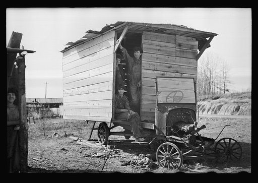 One-room hut housing family of nine built over chassis of abandoned Ford in open field between Camden and Bruceton, Tennessee, near Tennessee River