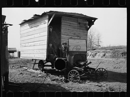 Untitled photo, possibly related to: One-room hut housing family of nine built over chassis of abandoned Ford in open field between Camden and Bruceton, Tennessee, near Tennessee River