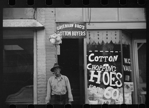 Typical view of store and cotton trader in small Arkansas town. This one made in Marianna, Arkansas